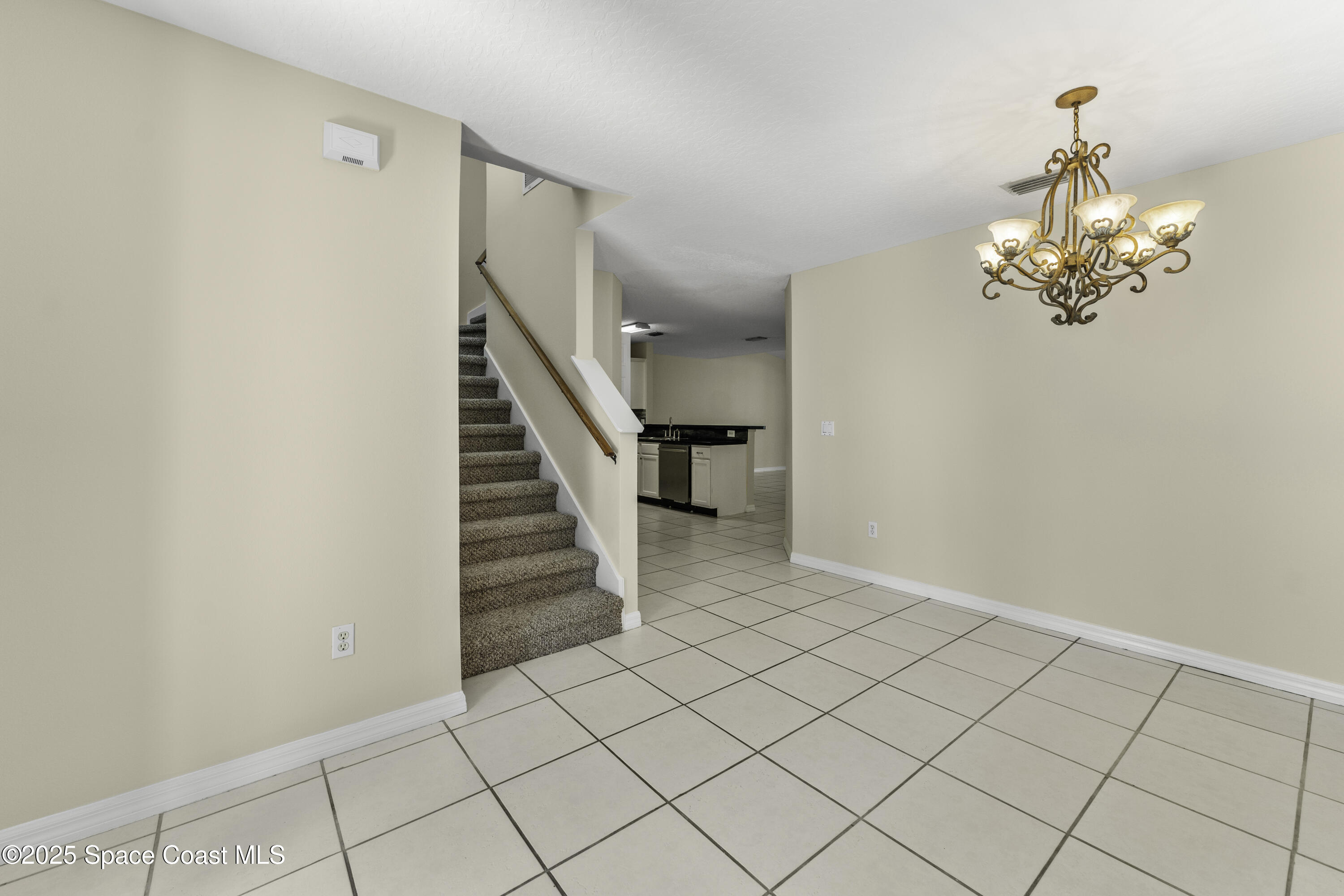 36 Sunset Street Satellite Beach, FL 32937 - Photo 12 of 45 a view of a livingroom with stairs