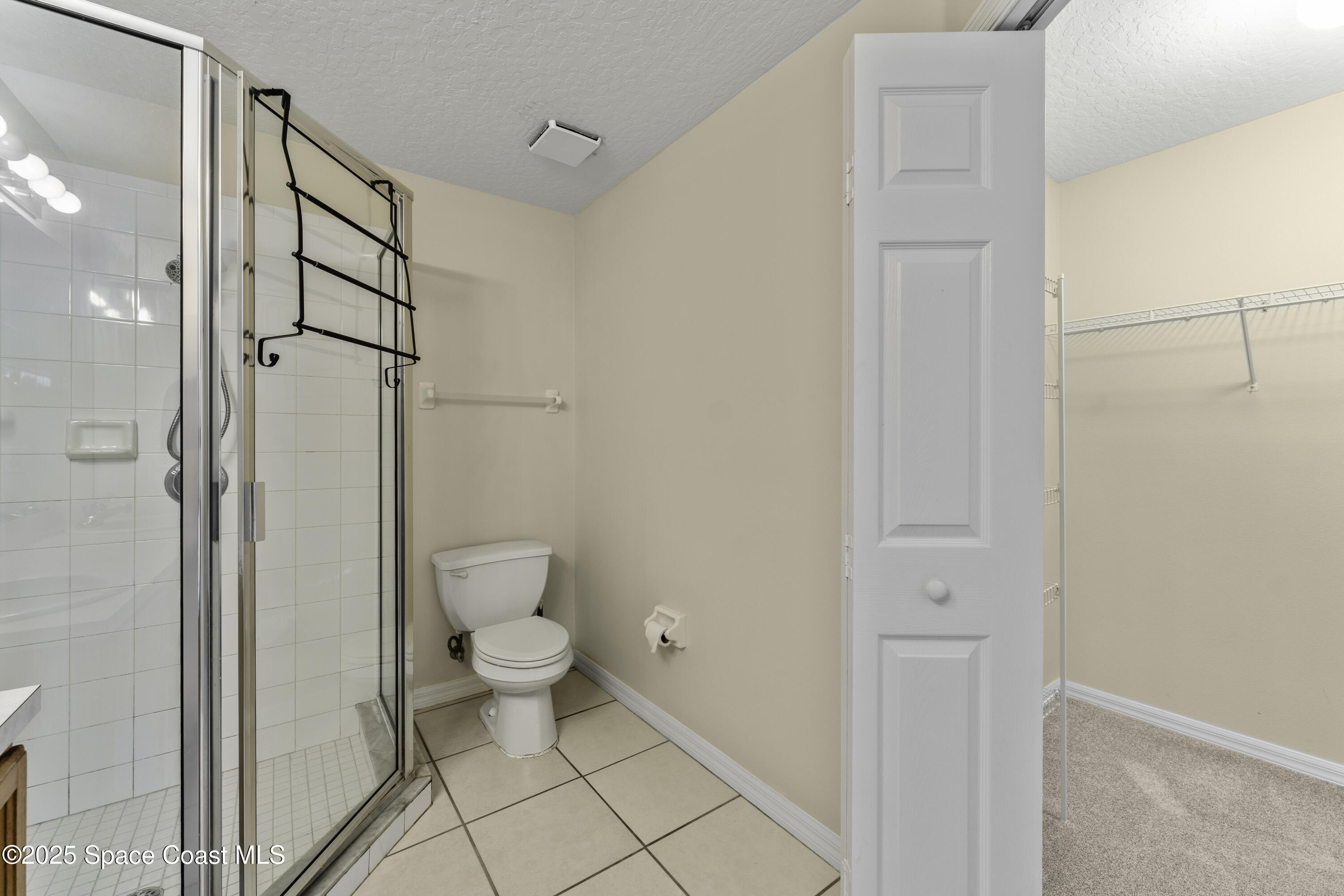 36 Sunset Street Satellite Beach, FL 32937 - Photo 17 of 45 a bathroom with a toilet and a shower