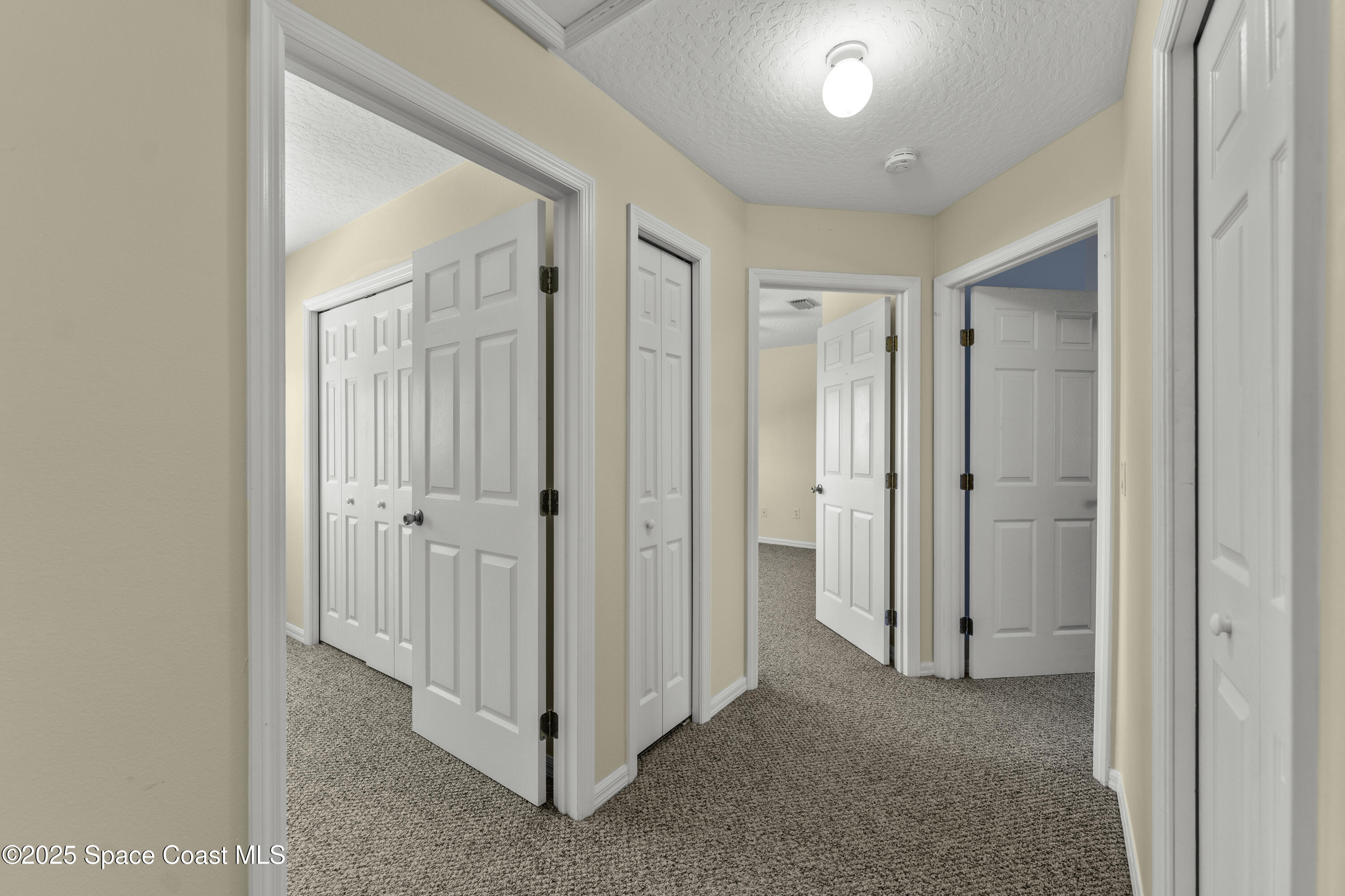 36 Sunset Street Satellite Beach, FL 32937 - Photo 21 of 45 a view of a hallway with closet area