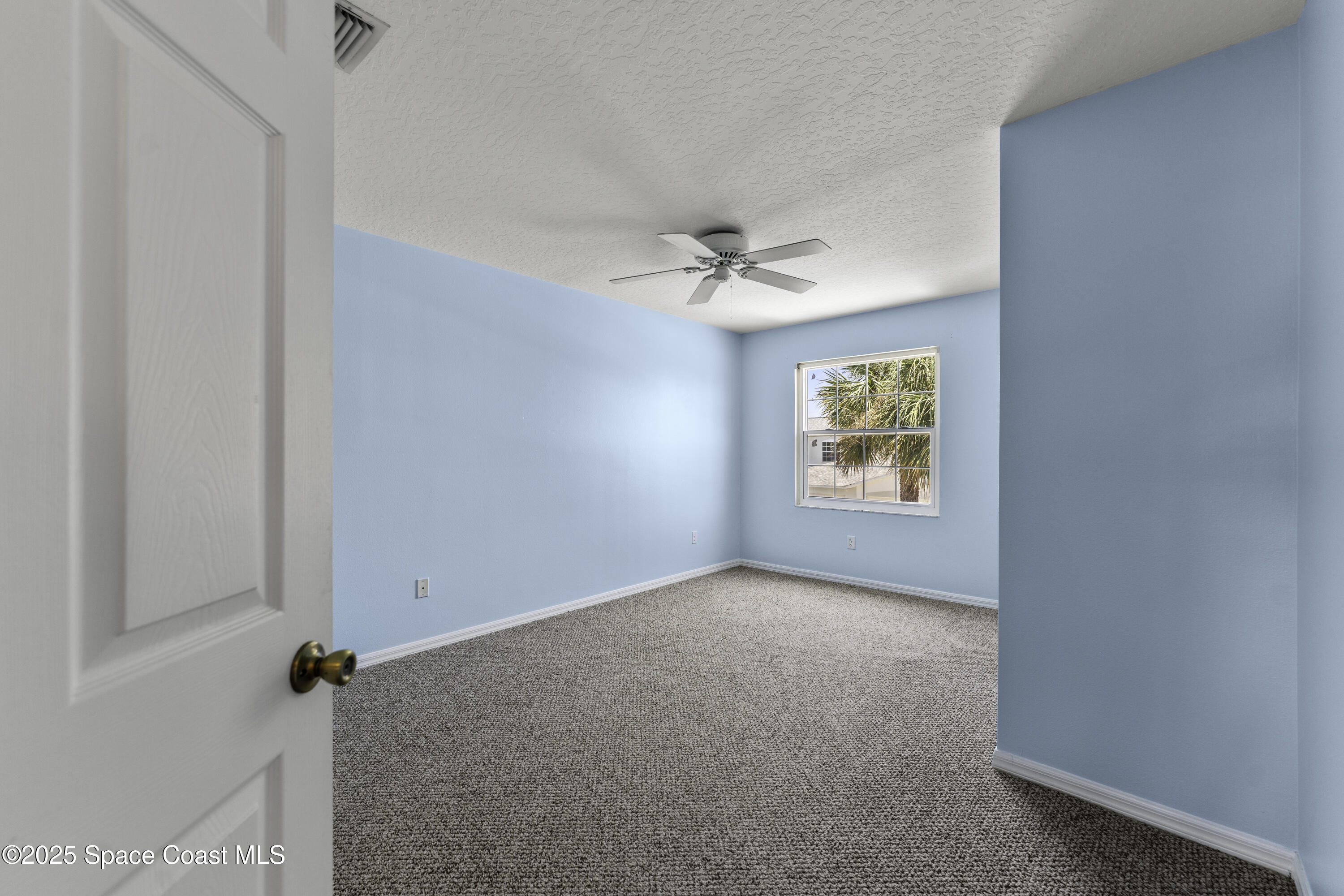36 Sunset Street Satellite Beach, FL 32937 - Photo 26 of 45 an empty room with windows and fan