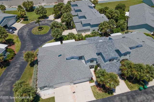 an aerial view of house with yard