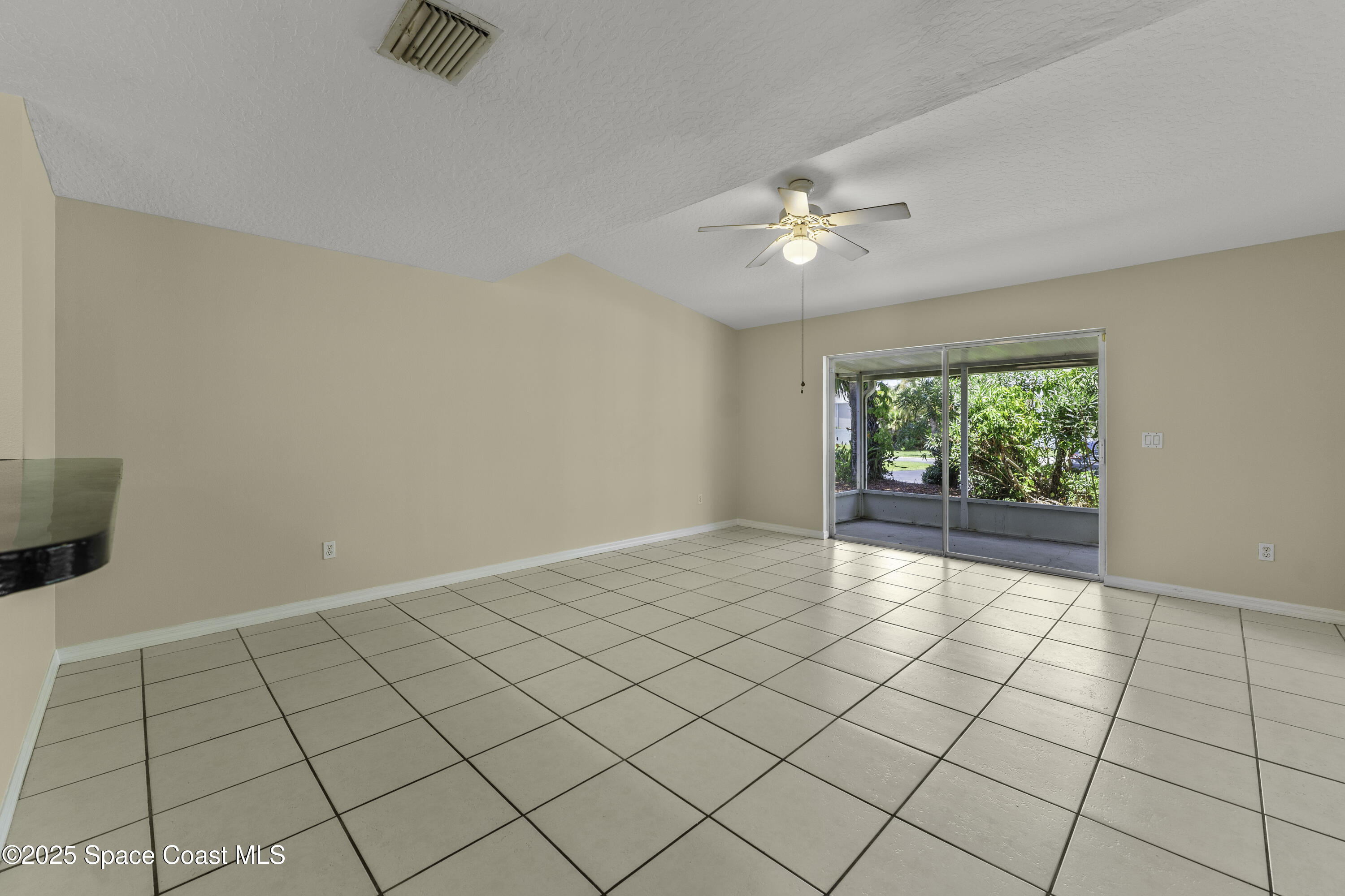 36 Sunset Street Satellite Beach, FL 32937 - Photo 10 of 45 a view of an empty room and window