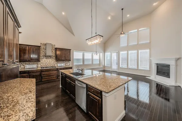 a kitchen with a stove sink and microwave