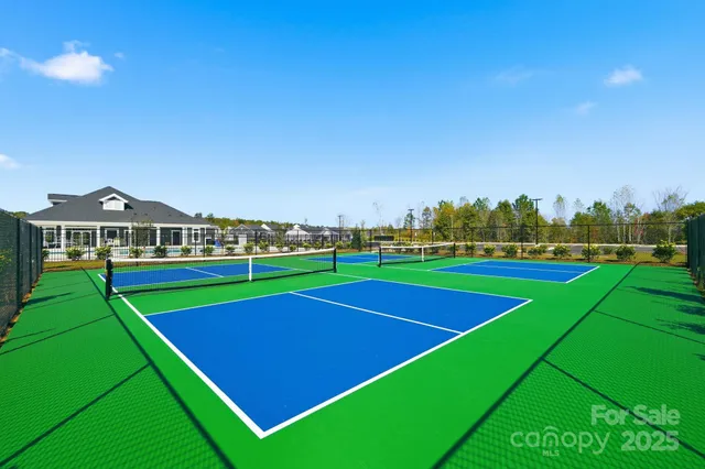a view of a roof deck with two chairs