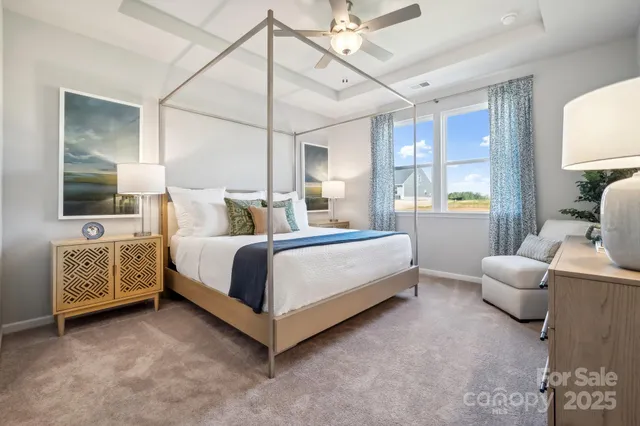 a bedroom with a bed couch and window