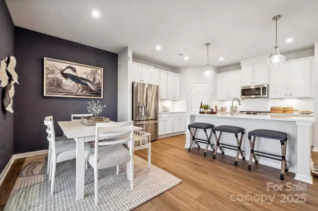 a view of kitchen with cabinets and stainless steel appliances