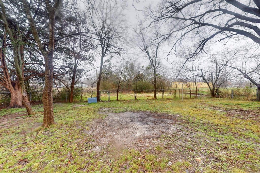 505 Oak Street Commerce, TX 75428 - Photo 25 of 28 a view of a yard with a tree