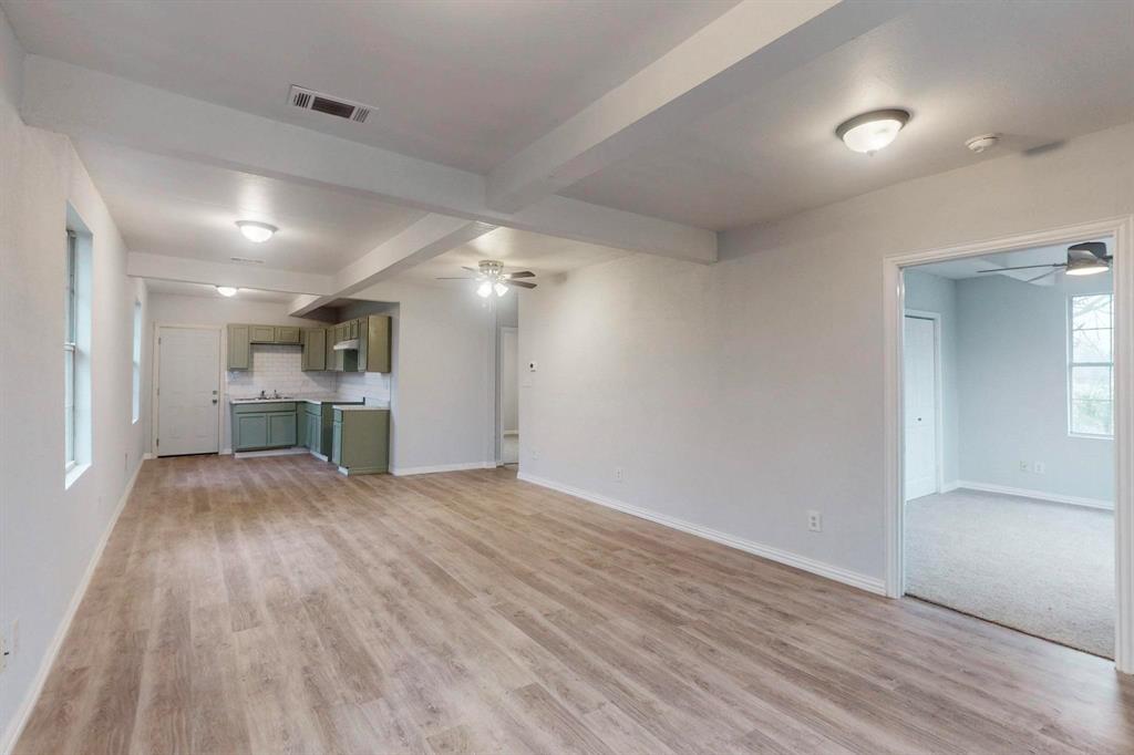 505 Oak Street Commerce, TX 75428 - Photo 4 of 28 a view of empty room with wooden floor