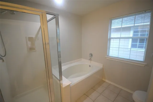 a bathroom with a sink and mirror with toilet