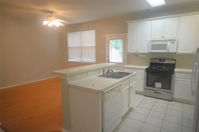 a bathroom with a sink toilet and a mirror