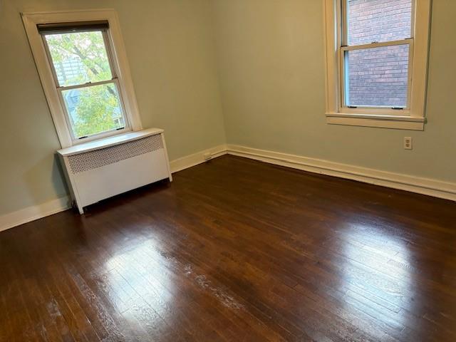 5648 Melvin Street Pittsburgh, PA 15217 - Photo 15 of 22 an empty room with wooden floor and windows