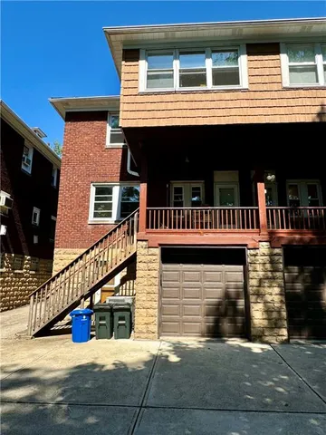 a view of a house with large windows
