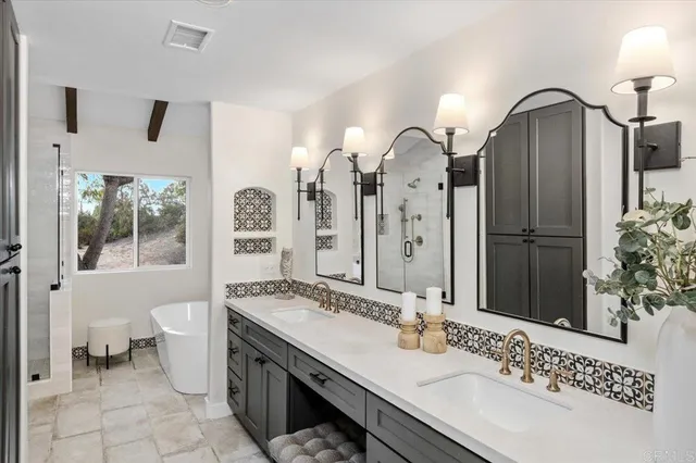 a bathroom with a granite countertop sink mirror and toilet