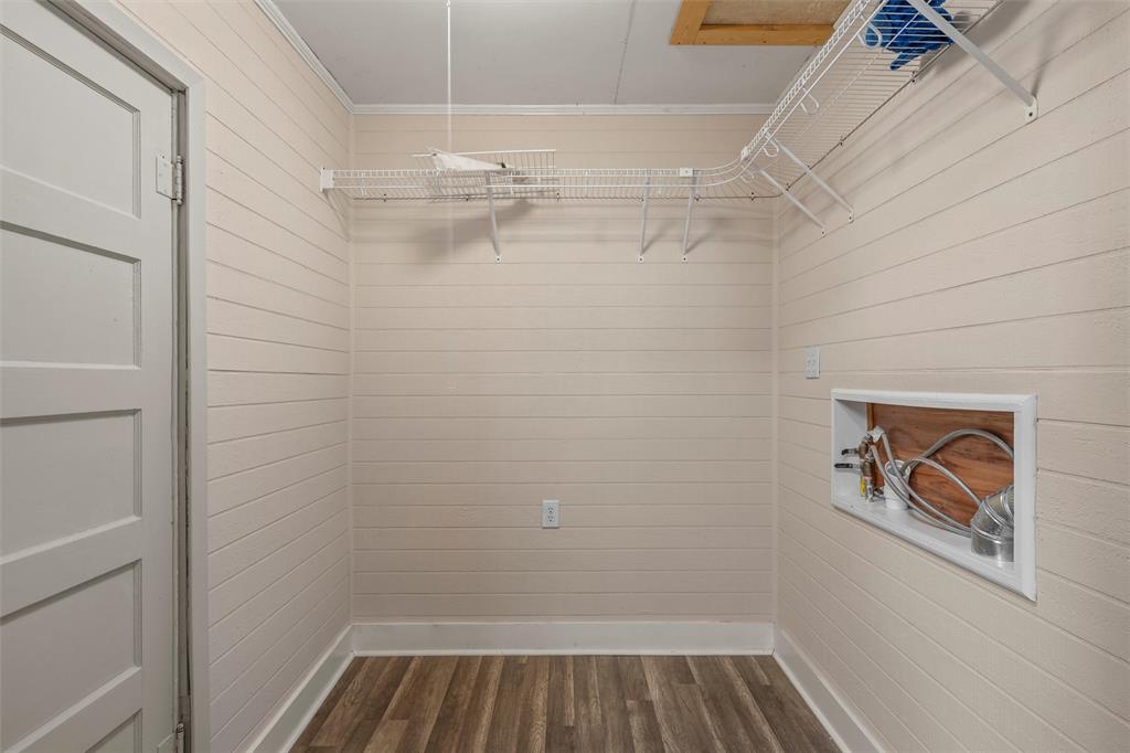 2912 Edmond Avenue Waco, TX 76707 - Photo 11 of 30 Walk in closet featuring dark wood finished floors