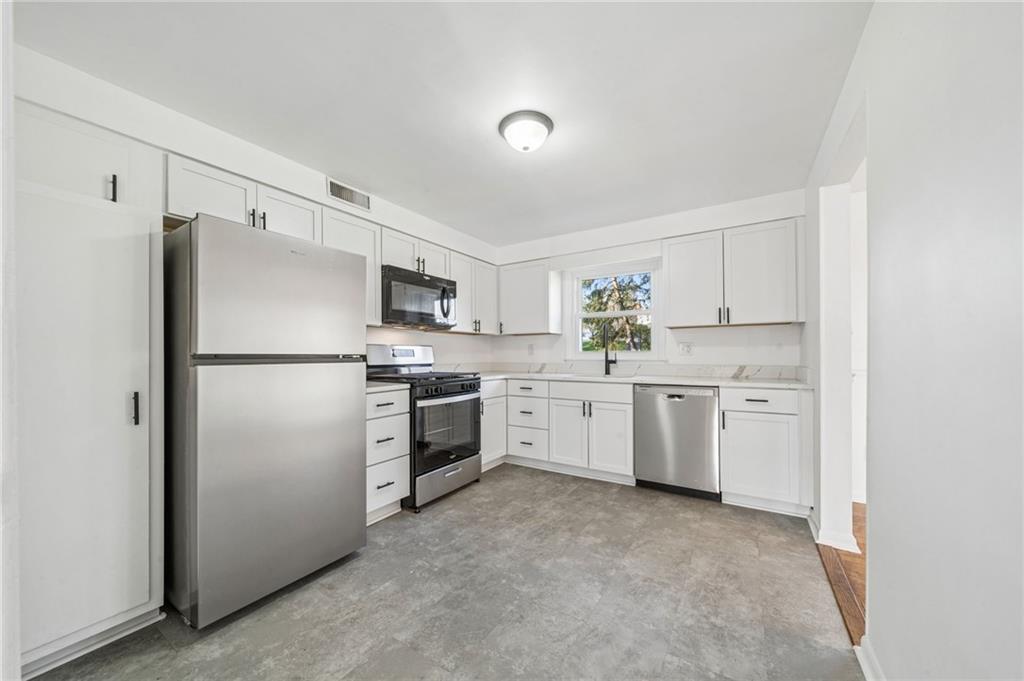 773 Homestead Avenue Scottdale, PA 15683 - Photo 11 of 28 a kitchen with a refrigerator a sink and dishwasher