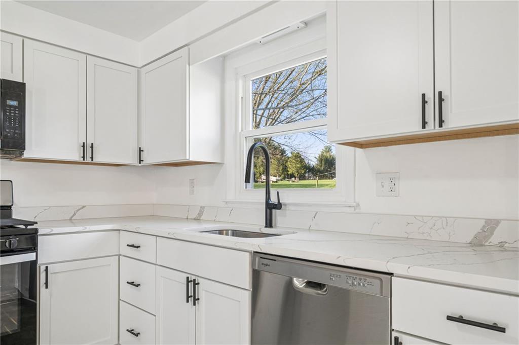 773 Homestead Avenue Scottdale, PA 15683 - Photo 13 of 28 a kitchen with white cabinets and a sink