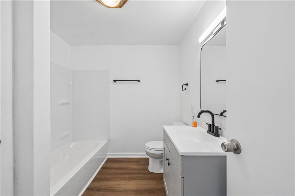 773 Homestead Avenue Scottdale, PA 15683 - Photo 14 of 28 a bathroom with a sink a toilet and shower