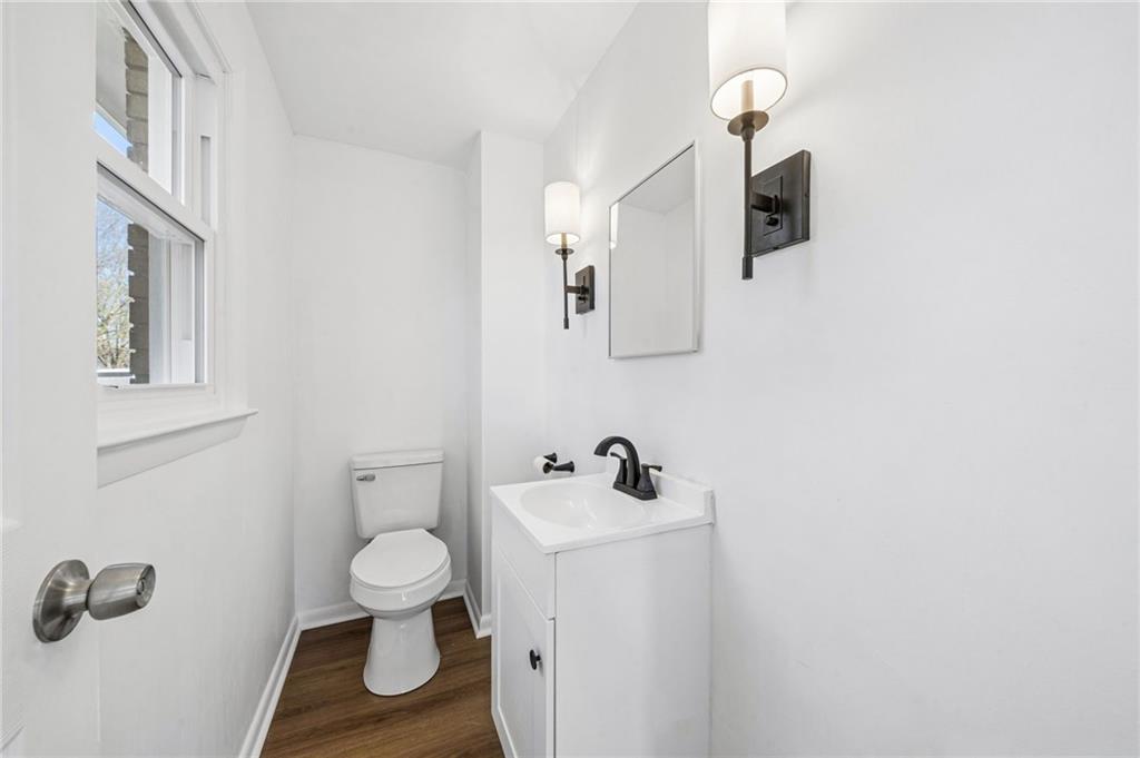 773 Homestead Avenue Scottdale, PA 15683 - Photo 16 of 28 a bathroom with a toilet sink and mirror