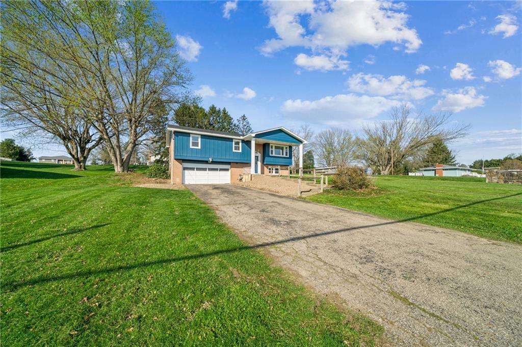 773 Homestead Avenue Scottdale, PA 15683 - Photo 2 of 28 a front view of a house with garden