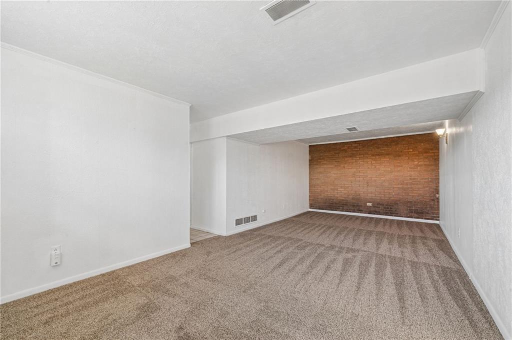 773 Homestead Avenue Scottdale, PA 15683 - Photo 21 of 28 a view of an empty room with wooden floor