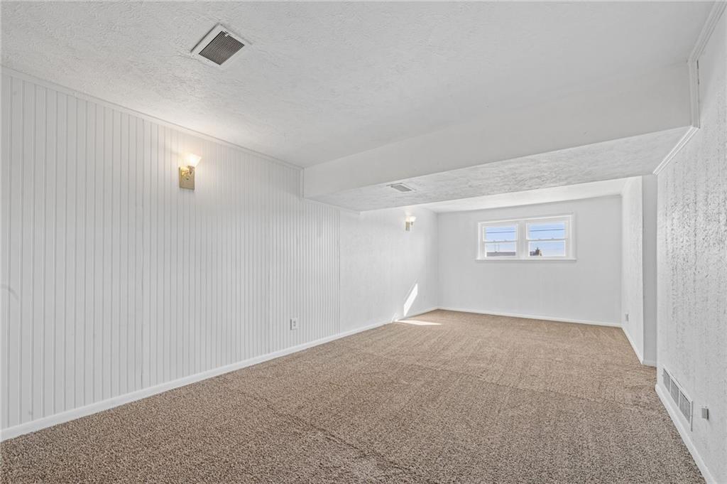 773 Homestead Avenue Scottdale, PA 15683 - Photo 22 of 28 an empty room with a empty space and windows