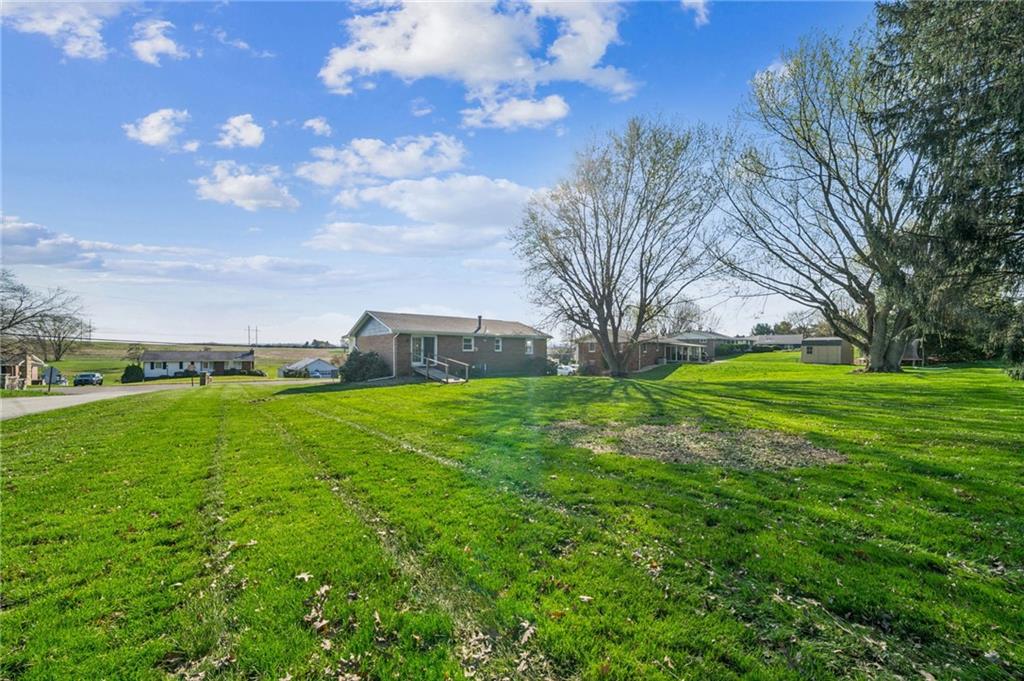 773 Homestead Avenue Scottdale, PA 15683 - Photo 24 of 28 a view of a field with large trees