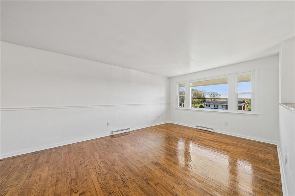 773 Homestead Avenue Scottdale, PA 15683 - Photo 3 of 28 a view of empty room with wooden floor