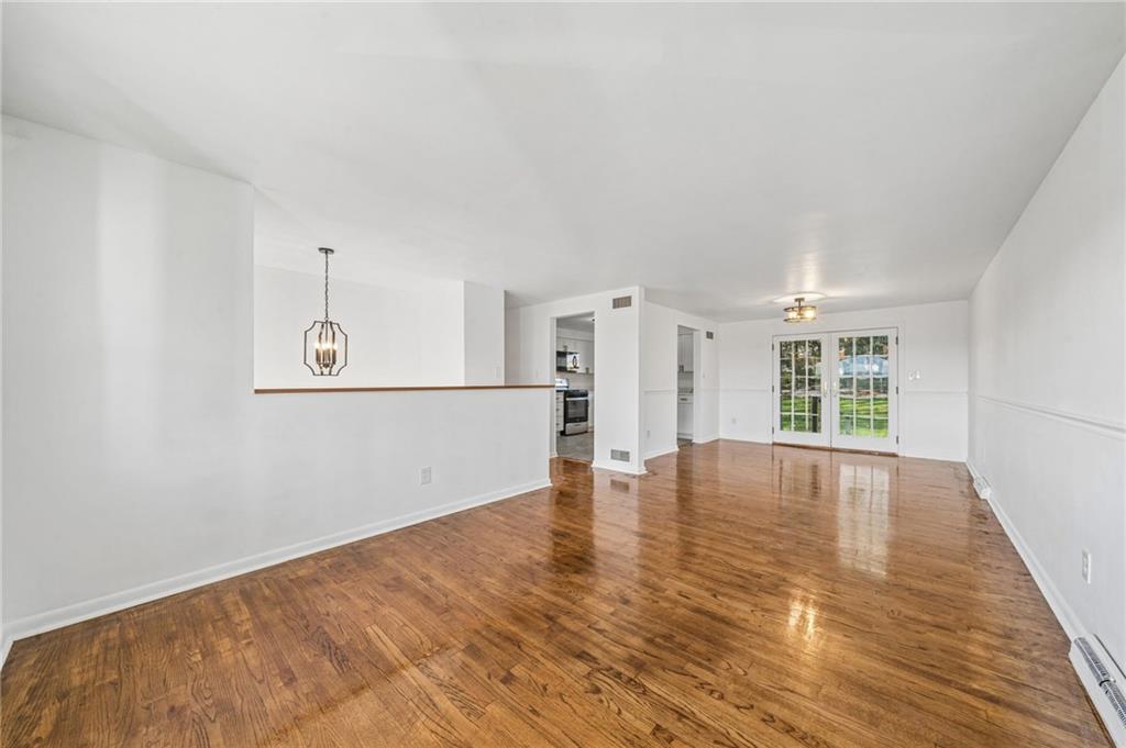 773 Homestead Avenue Scottdale, PA 15683 - Photo 5 of 28 wooden floor in an empty room with a window