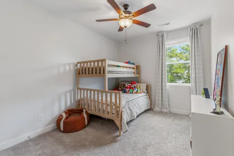 a bedroom with furniture and a window