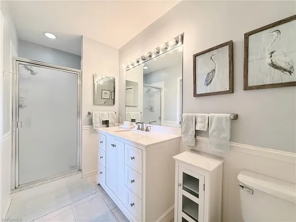 a kitchen with a sink and a refrigerator