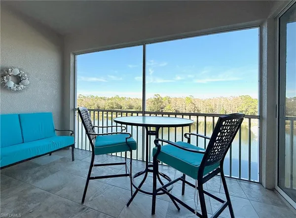 a view of a chairs and table in patio