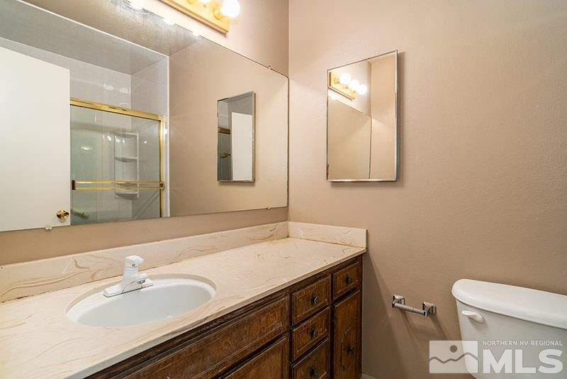 1401 Peavine Road Reno, NV 89503 - Photo 15 of 17 a bathroom with a sink and a mirror