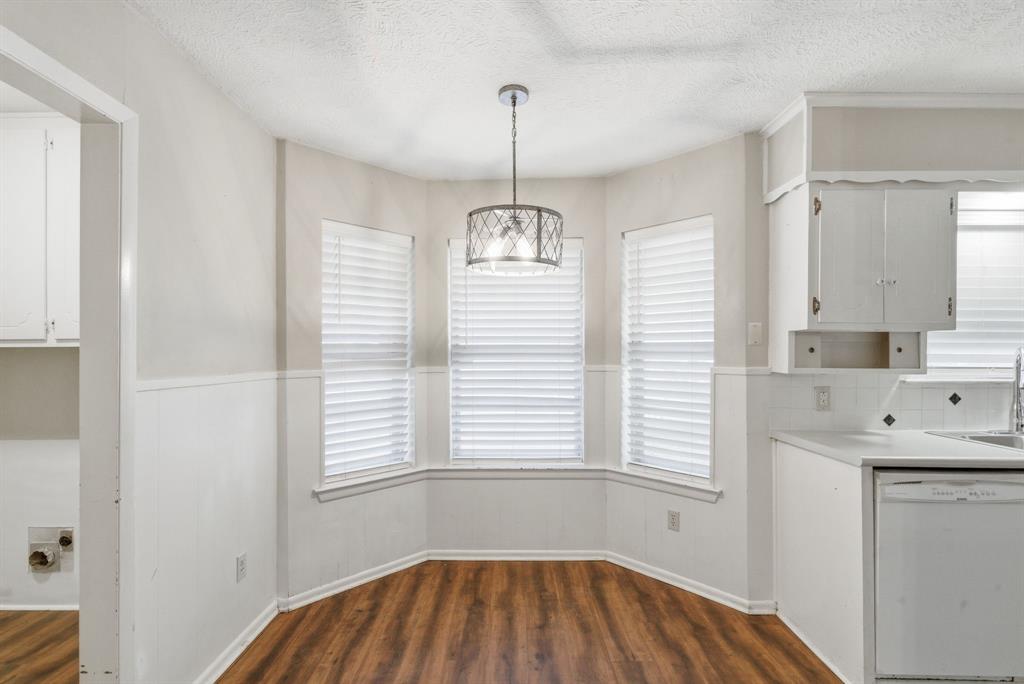120 Timberlake Drive Azle, TX 76020 - Photo 13 of 32 a bathroom with a window sink and mirror