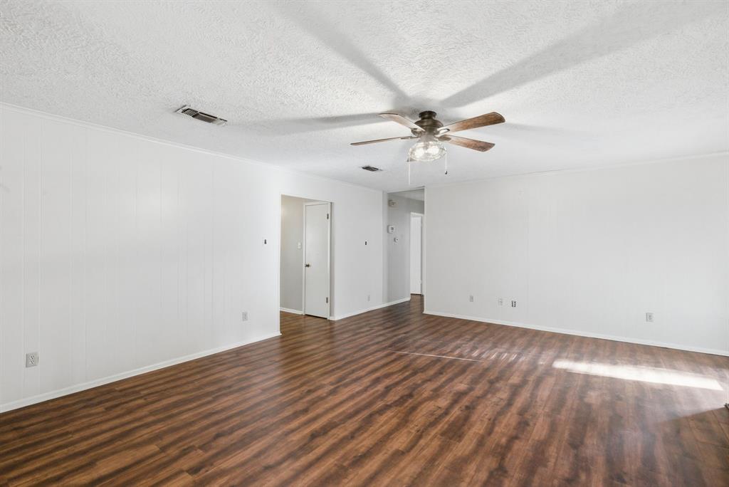 120 Timberlake Drive Azle, TX 76020 - Photo 14 of 32 a view of an empty room with wooden floor