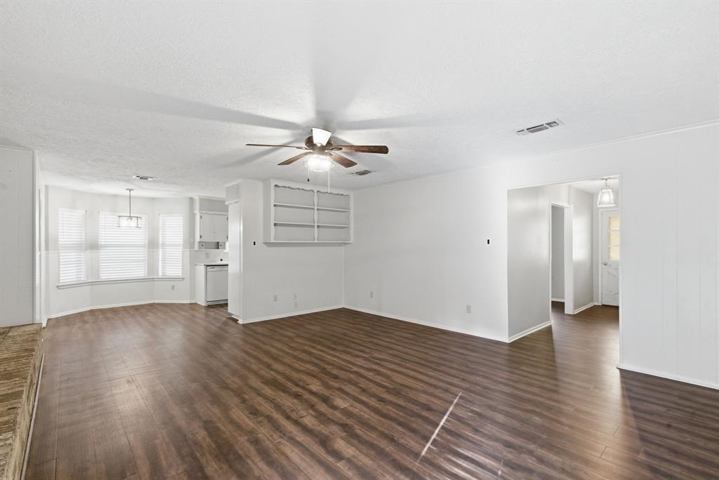 120 Timberlake Drive Azle, TX 76020 - Photo 17 of 32 an empty room with wooden floor and windows