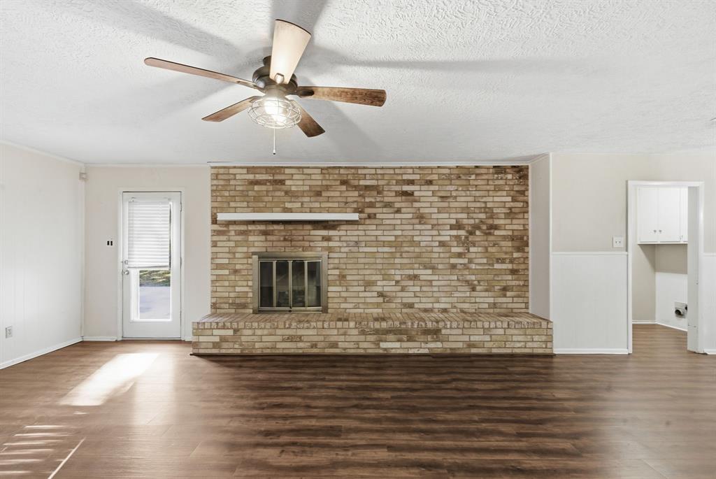 120 Timberlake Drive Azle, TX 76020 - Photo 18 of 32 a view of empty room with wooden floor and fan