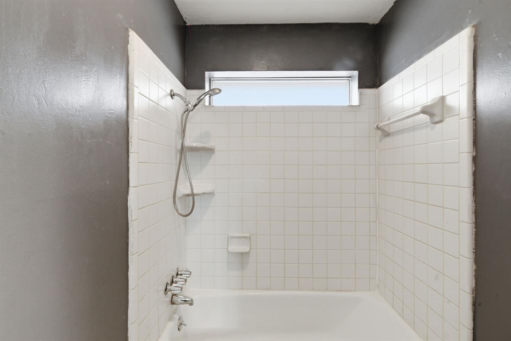 120 Timberlake Drive Azle, TX 76020 - Photo 20 of 32 a bathroom with a glass shower door