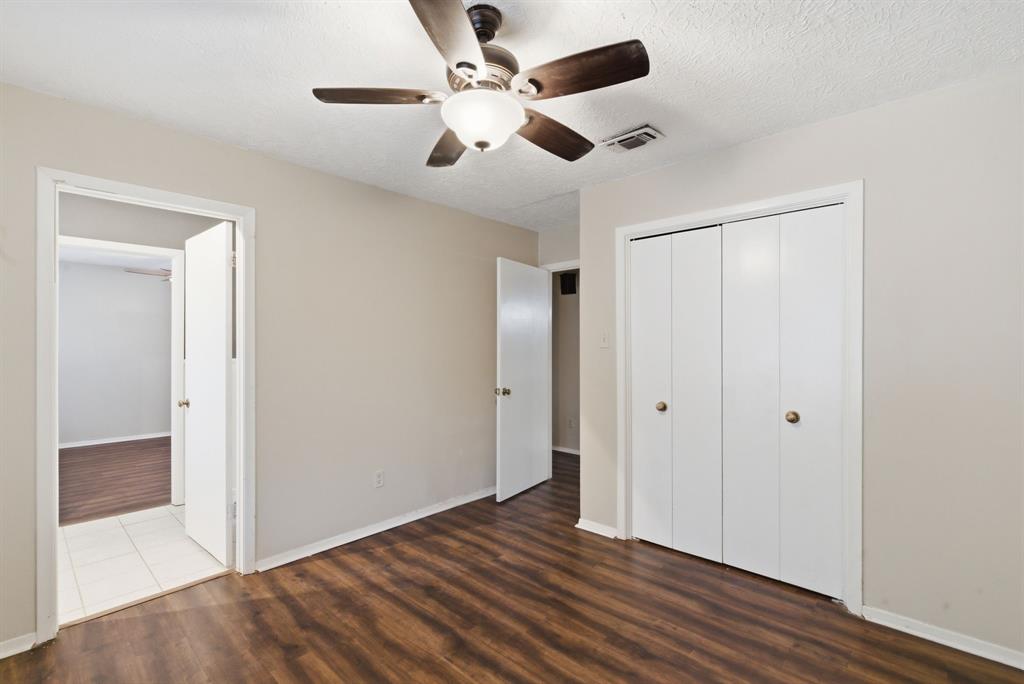 120 Timberlake Drive Azle, TX 76020 - Photo 24 of 32 a view of an empty room with wooden floor