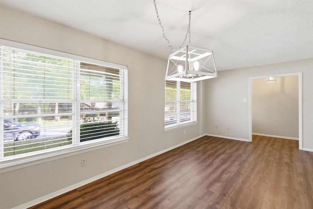 120 Timberlake Drive Azle, TX 76020 - Photo 9 of 32 a view of empty room with wooden floor and fan