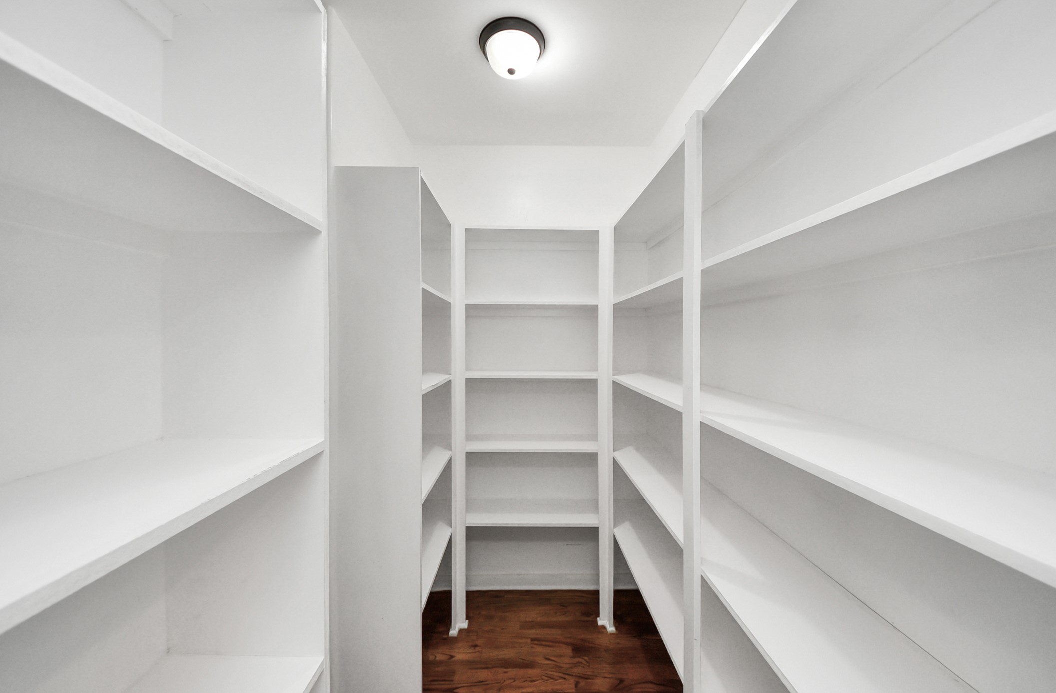 509 Vincent Street Houston, TX 77009 - Photo 18 of 39 a view of walk in closet with empty racks