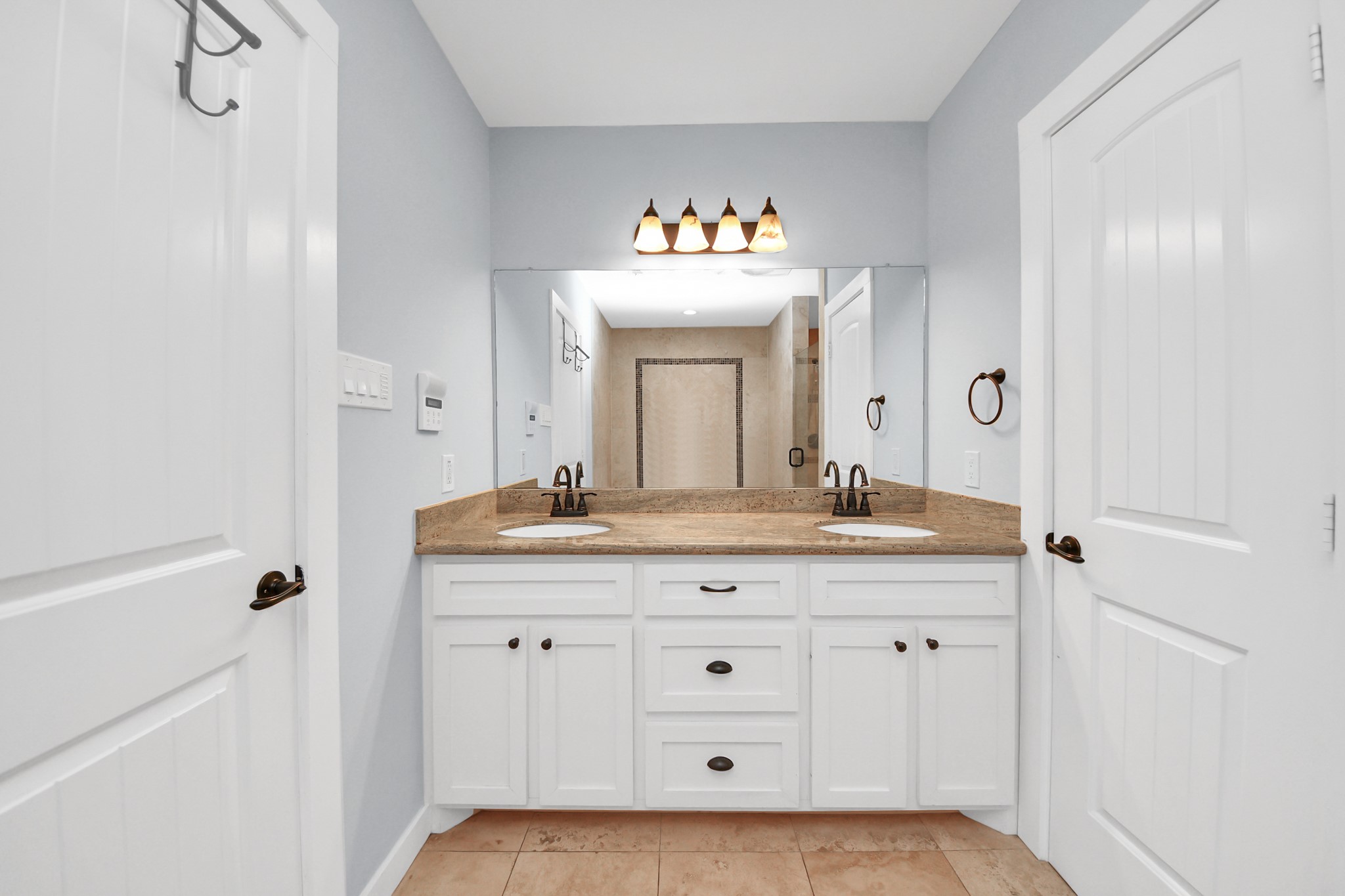 509 Vincent Street Houston, TX 77009 - Photo 24 of 39 a spacious bathroom with a granite countertop sink a mirror and a