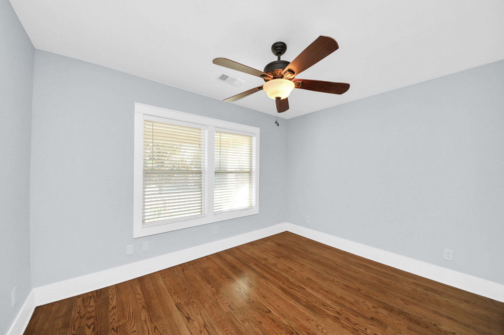 509 Vincent Street Houston, TX 77009 - Photo 26 of 39 a view of an empty room with wooden floor and a window