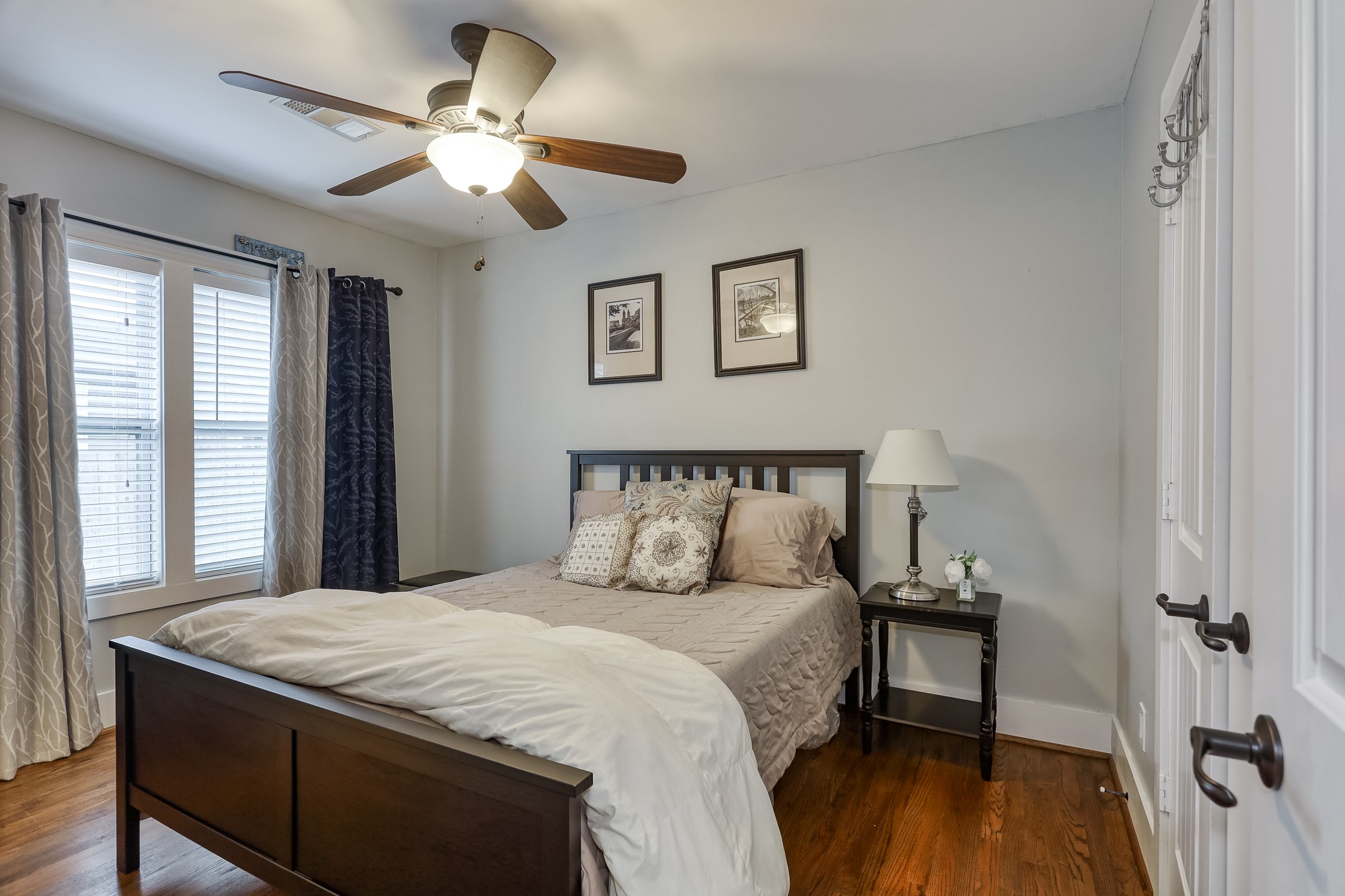 509 Vincent Street Houston, TX 77009 - Photo 27 of 39 a bedroom with a bed and a chandelier