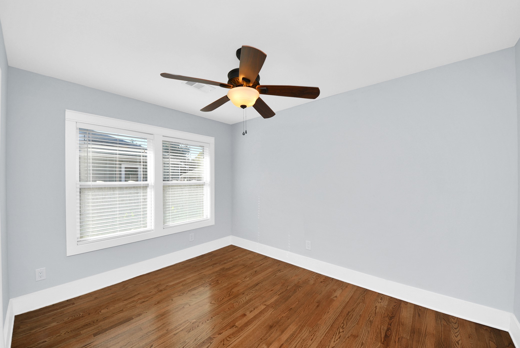 509 Vincent Street Houston, TX 77009 - Photo 30 of 39 a view of empty room with wooden floor and fan