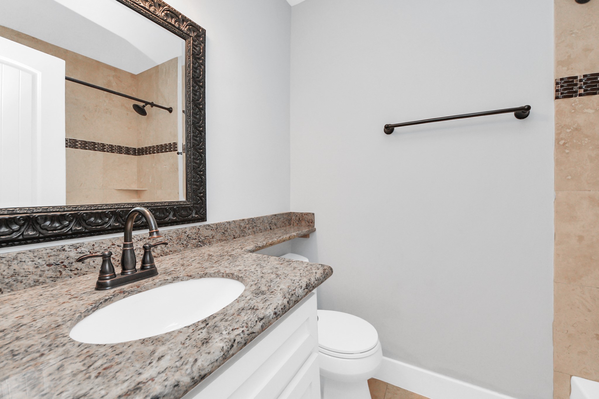 509 Vincent Street Houston, TX 77009 - Photo 32 of 39 a bathroom with a granite countertop sink toilet and mirror