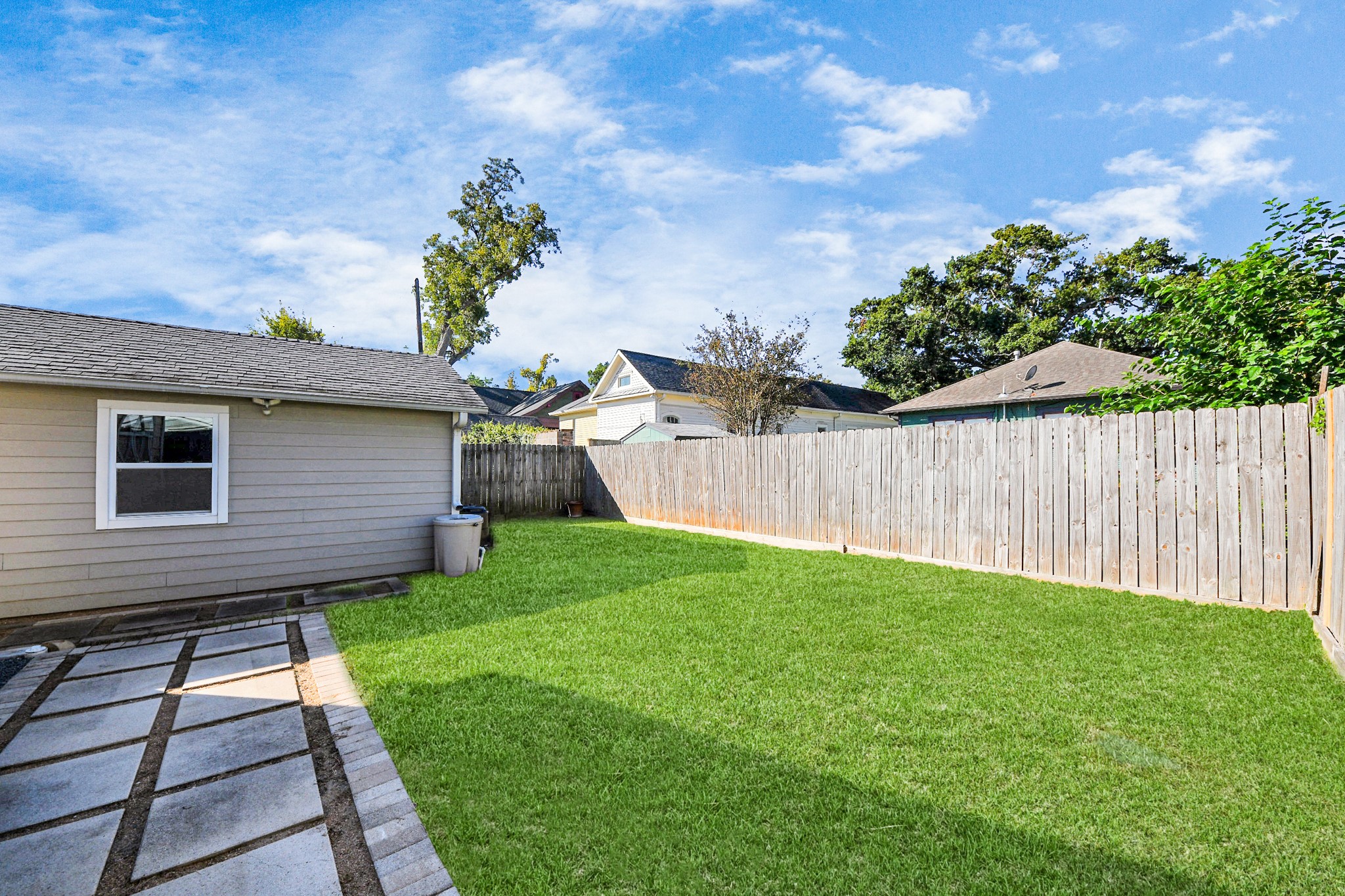 509 Vincent Street Houston, TX 77009 - Photo 36 of 39 a backyard of a house with lots of green space