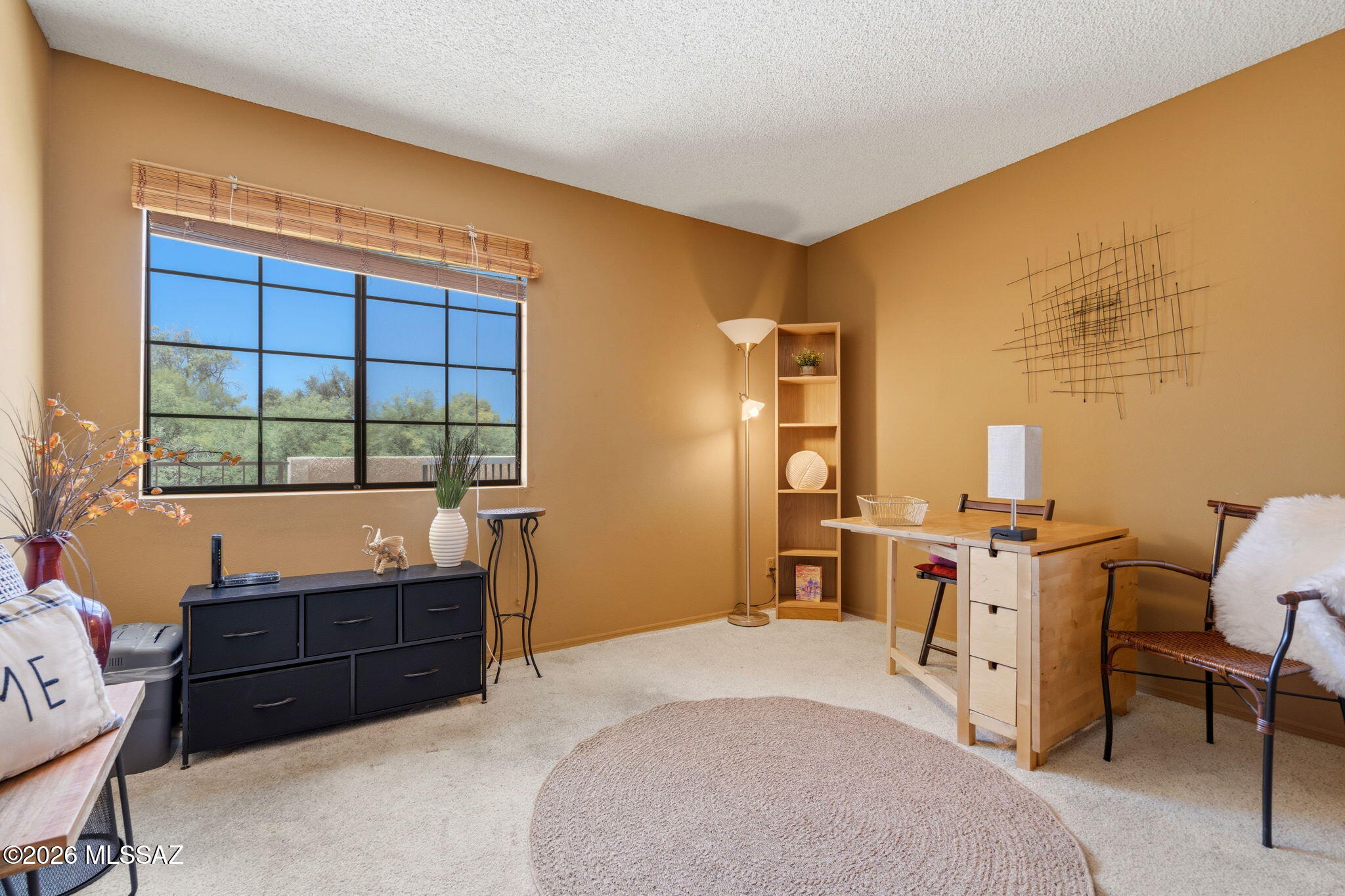 1200 East River Road, Unit G87 Tucson, AZ 85718 - Photo 21 of 30 a bedroom with a bed and a window