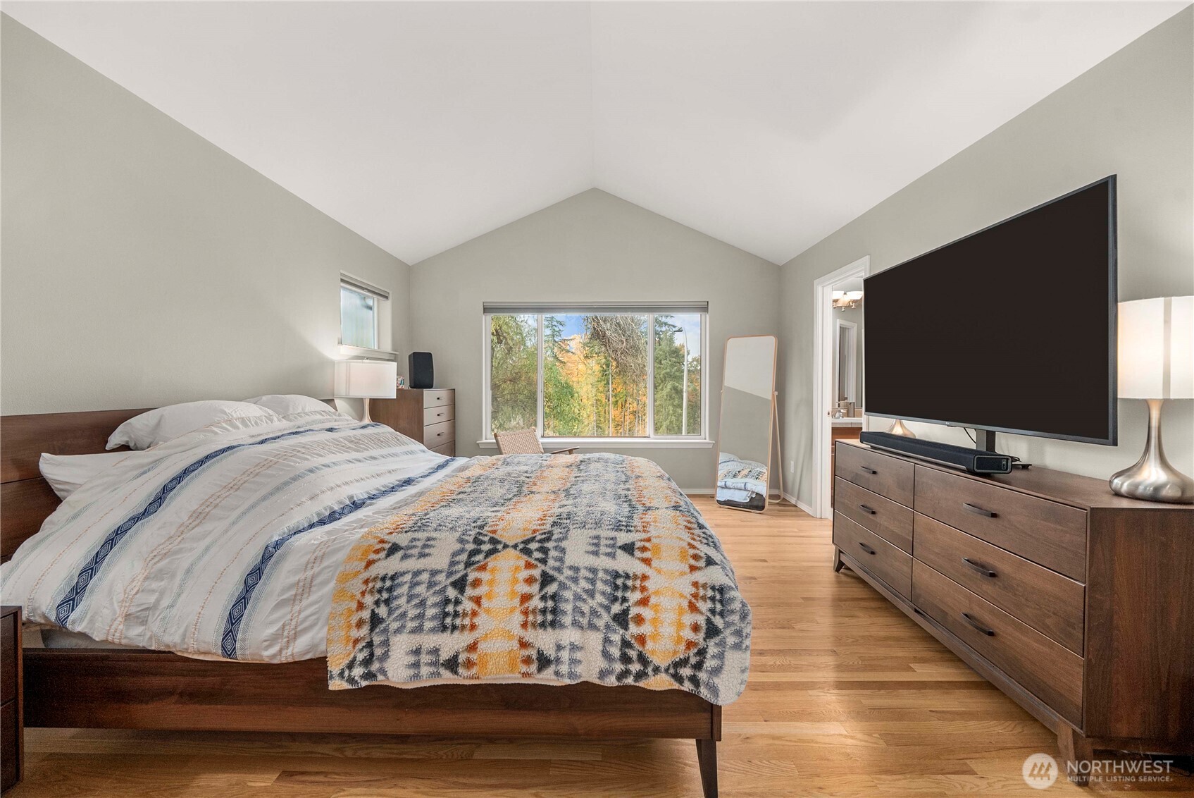 3723 Lincoln Court Northeast Renton, WA 98056 - Photo 20 of 37 a bedroom with a bed and a flat screen tv