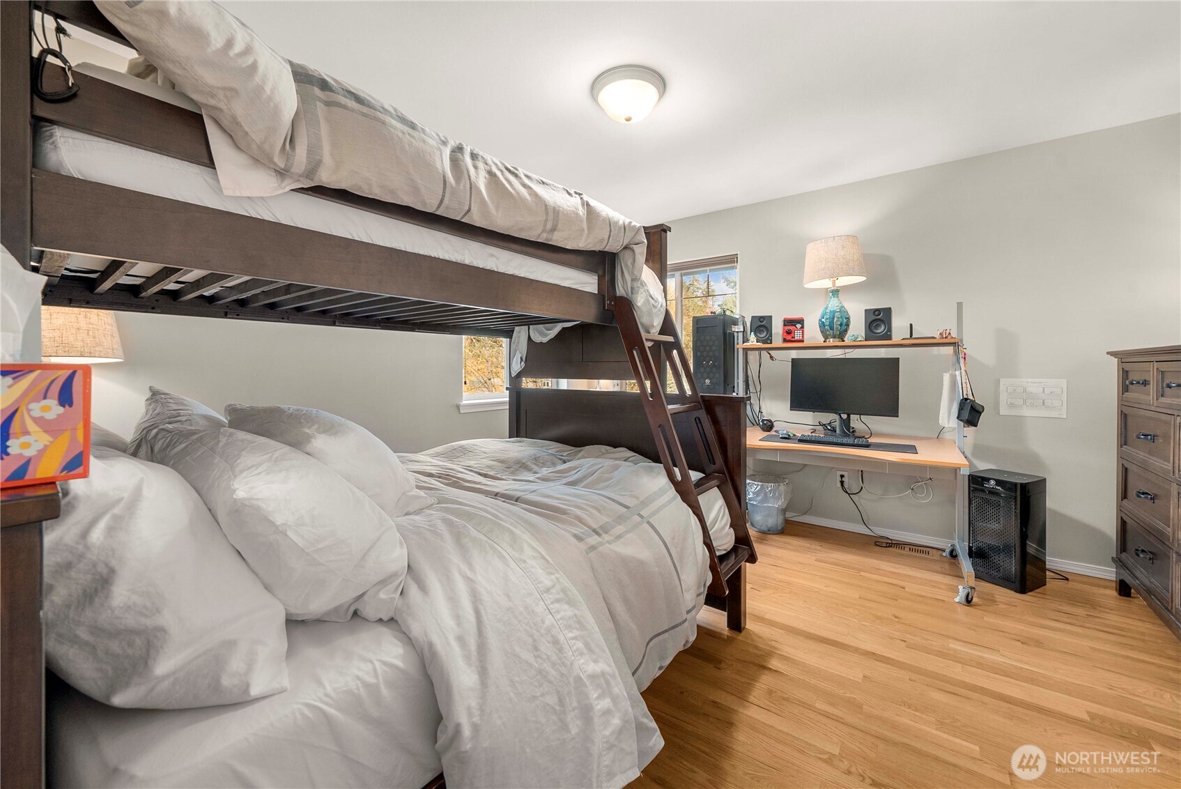 3723 Lincoln Court Northeast Renton, WA 98056 - Photo 26 of 37 a bedroom with a bed and a flat screen tv