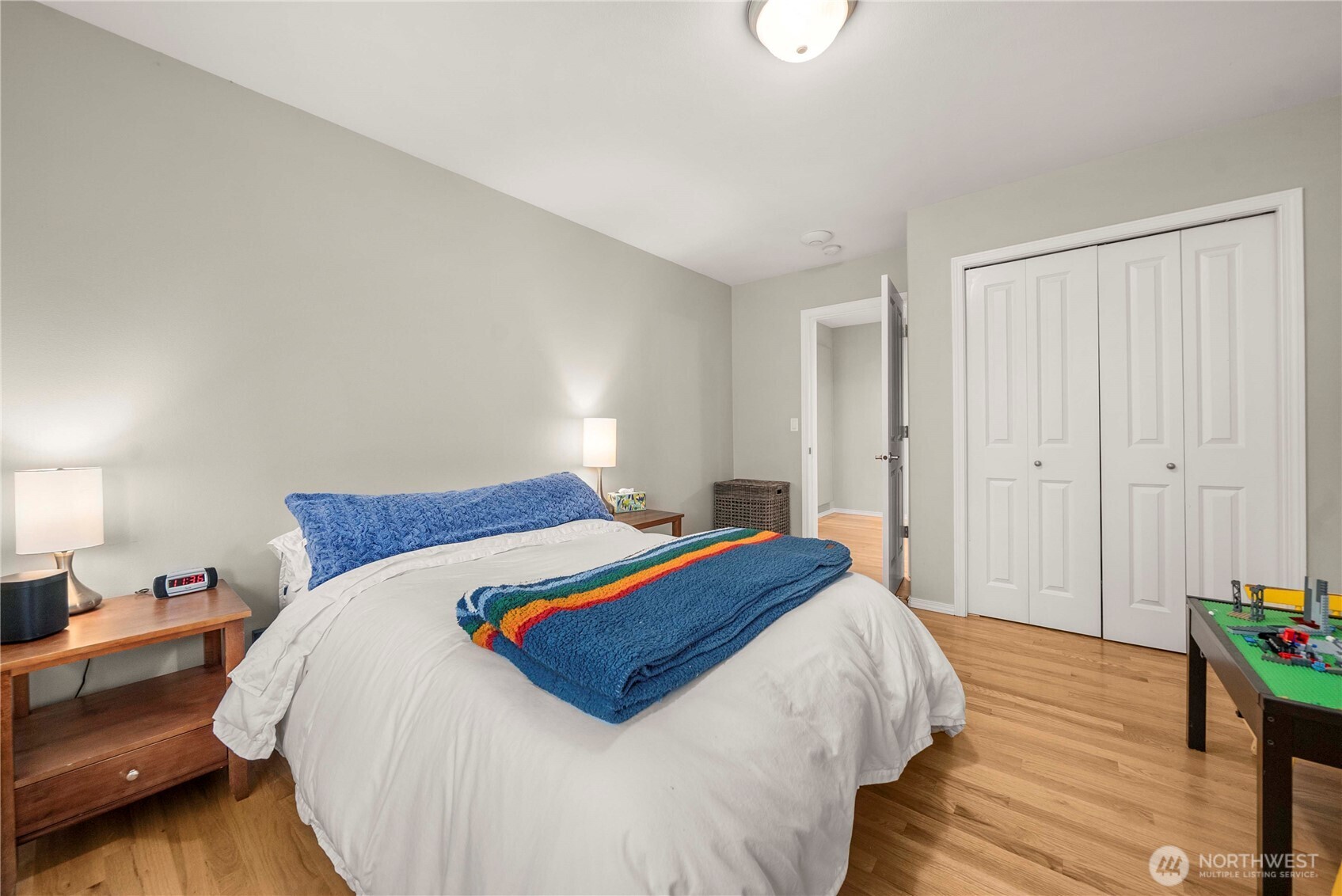 3723 Lincoln Court Northeast Renton, WA 98056 - Photo 27 of 37 a bed sitting in a bedroom and chandelier